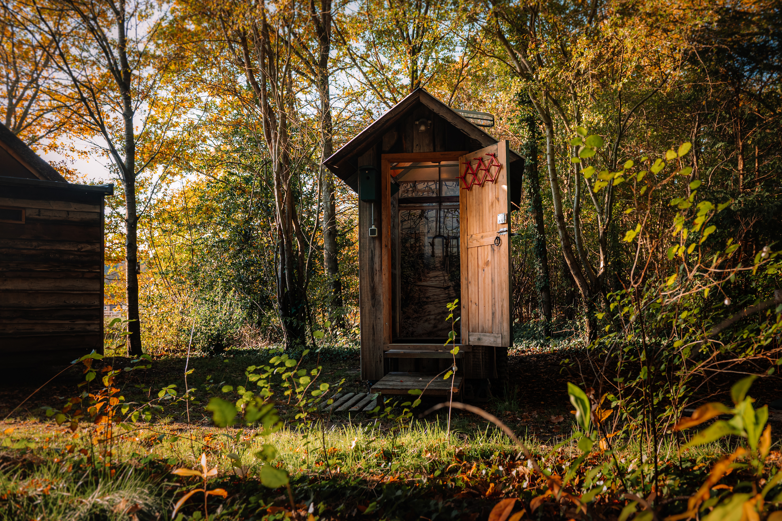 Circular sanitary house on wheels at a campspace